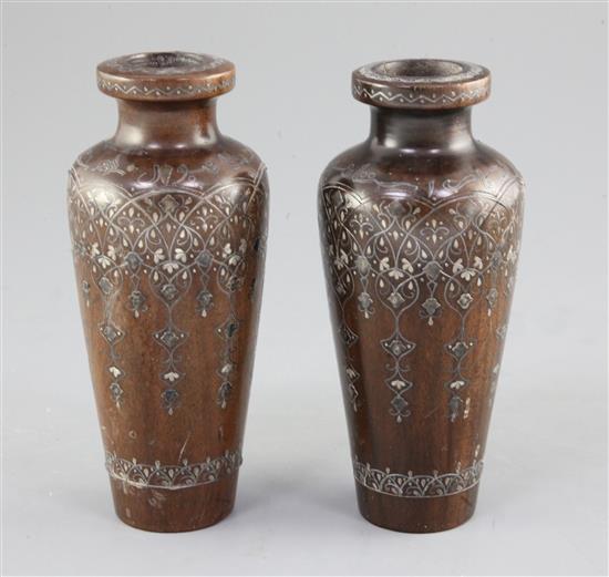 A pair of Turkish hardwood and silver inlaid vases, dated 1914, 15.5cm